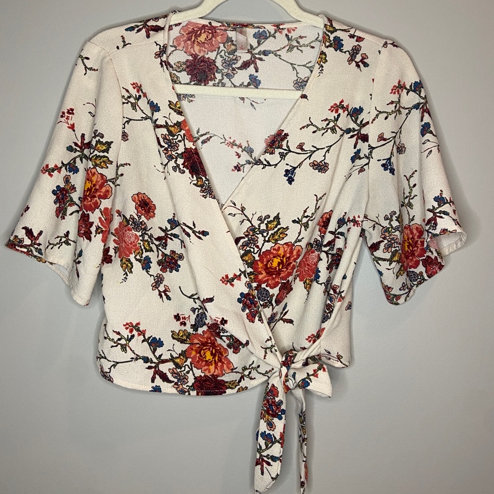 cropped floral patterned wrap blouse